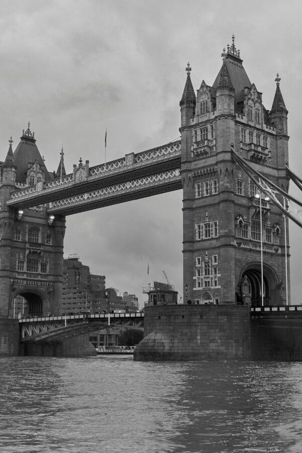 Black and white photograph capturing the iconic Tower Bridge in London, showcasing its stunning architecture.