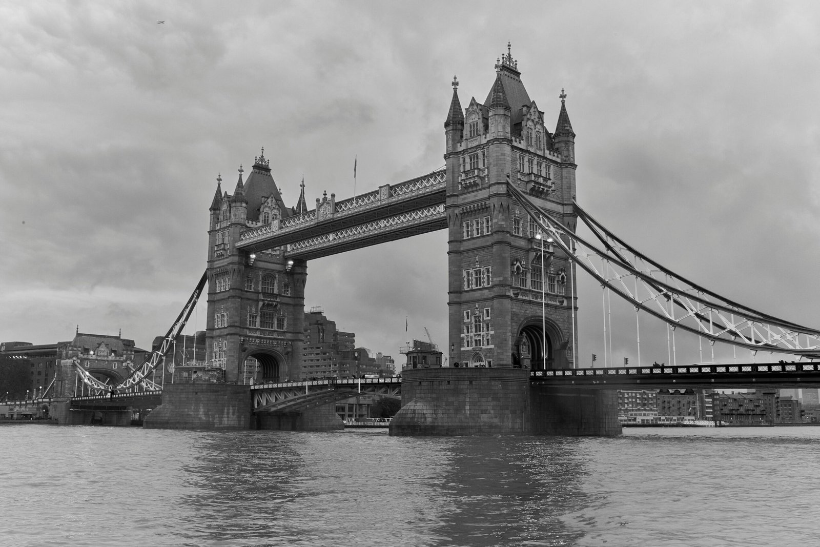 Black and white photograph capturing the iconic Tower Bridge in London, showcasing its stunning architecture.
